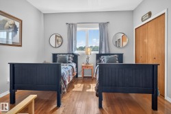Hardwood flooring and light gray walls define this room - 