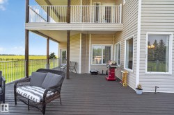 Multi-level deck and balcony with vinyl siding exterior - 