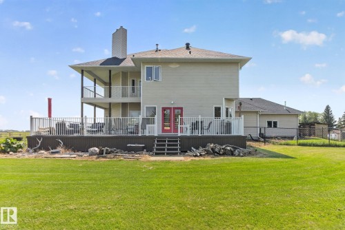 Expansive outdoor deck with white railing and steps - 50336 Range Road 280, Rural Leduc County, AB - Outdoor