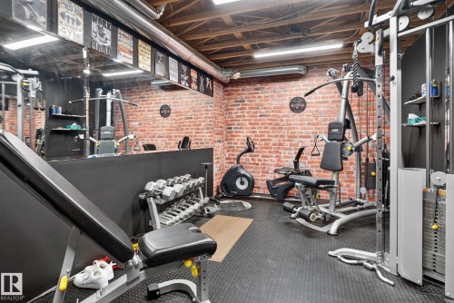 Recreation space featuring exposed brick accent walls and an exposed ceiling with ductwork - 50336 Range Road 280, Rural Leduc County, AB - Indoor