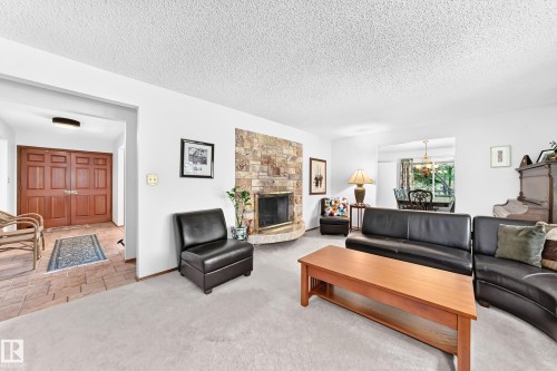 #24 25507 Twp Road 512 A, Rural Parkland County, AB - Indoor Photo Showing Living Room With Fireplace