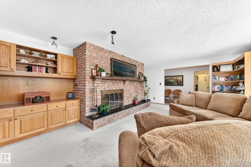 #24 25507 Twp Road 512 A, Rural Parkland County, AB - Indoor Photo Showing Living Room With Fireplace