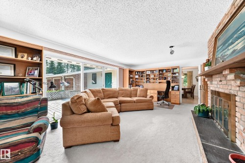 #24 25507 Twp Road 512 A, Rural Parkland County, AB - Indoor Photo Showing Living Room With Fireplace