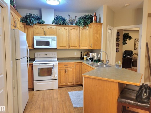 #106 4128 47 St, Drayton Valley, AB - Indoor Photo Showing Kitchen With Double Sink