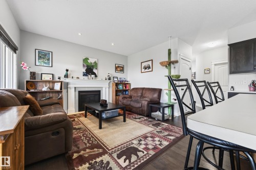 58 Woodbridge Link, Fort Saskatchewan, AB - Indoor Photo Showing Living Room With Fireplace