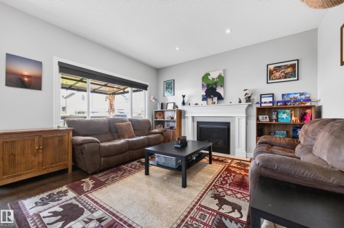 58 Woodbridge Link, Fort Saskatchewan, AB - Indoor Photo Showing Living Room With Fireplace