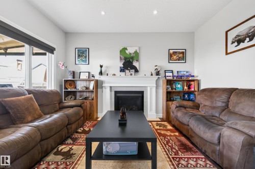 58 Woodbridge Link, Fort Saskatchewan, AB - Indoor Photo Showing Living Room With Fireplace