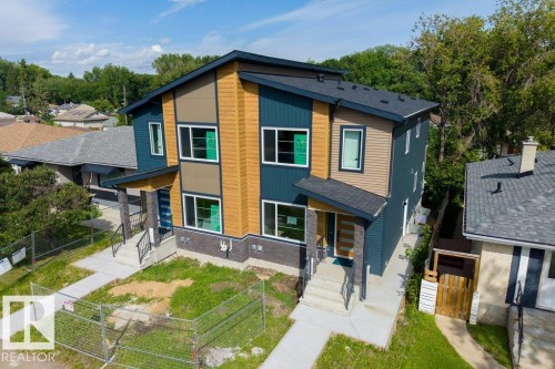 Modern duplex with dark blue and tan siding accents - 10323 79 Street Nw, Edmonton, AB - Outdoor