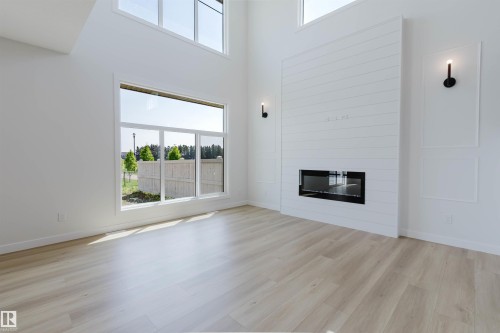 3327 Chernowski Way Sw, Edmonton, AB - Indoor Photo Showing Living Room With Fireplace