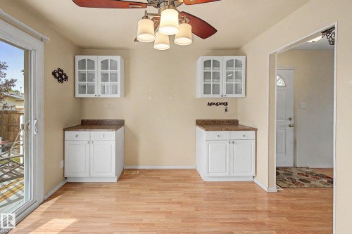 Dining area featuring wood-finish flooring and a ceiling fan with integrated lighting - 10032 173 Avenue Nw, Edmonton, AB - Indoor Photo Showing Other Room