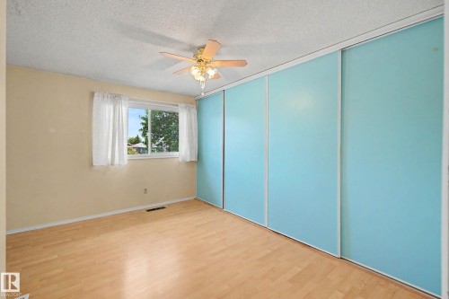 Bedroom featuring wood-finish flooring, a window with natural light, and a ceiling fan with light fixture - 10032 173 Avenue Nw, Edmonton, AB - Indoor Photo Showing Other Room
