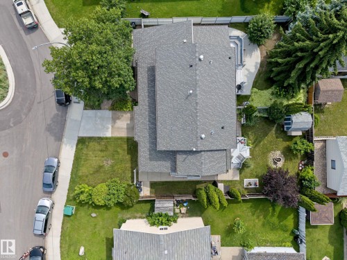 Expansive property featuring a grey shingle roof, paved driveway, and established landscaping - 10032 173 Avenue Nw, Edmonton, AB - Outdoor With View