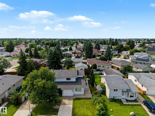 Suburban neighborhood featuring a variety of residential homes with pitched roofs and mature trees - 10032 173 Avenue Nw, Edmonton, AB - Outdoor With View