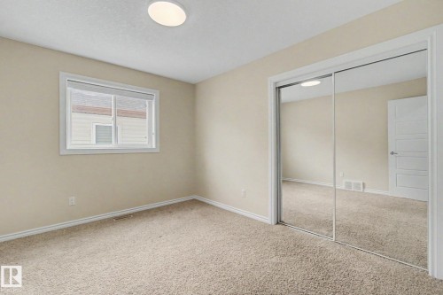 Neutral-toned wall paint throughout - 6016 10 Avenue Sw, Edmonton, AB - Indoor Photo Showing Other Room