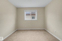 Neutral-toned walls complement the clean white window trim and baseboards - 