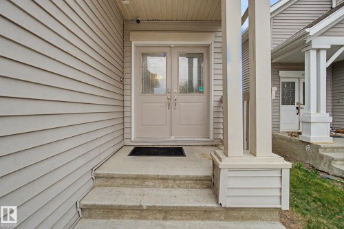 Entrance featuring double doors with decorative glass panels - 6016 10 Avenue Sw, Edmonton, AB - Outdoor With Exterior