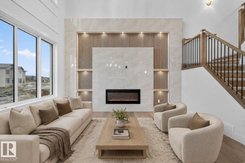 15728 9 Street Ne, Edmonton, AB - Indoor Photo Showing Living Room With Fireplace