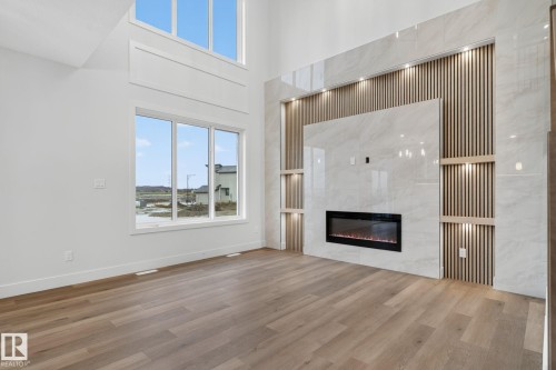 15728 9 Street Ne, Edmonton, AB - Indoor Photo Showing Living Room With Fireplace