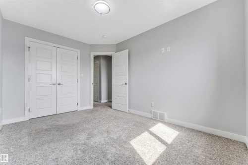 Light gray wall paint complemented by white trim and doors - 6075 180 Avenue Nw, Edmonton, AB - Indoor