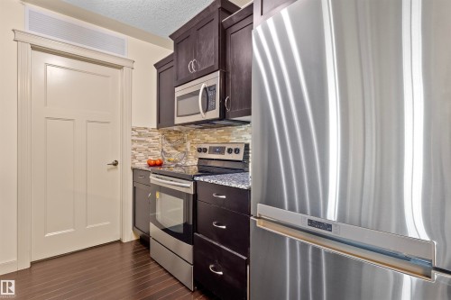 #301 16235 51 St Nw, Edmonton, AB - Indoor Photo Showing Kitchen With Stainless Steel Kitchen
