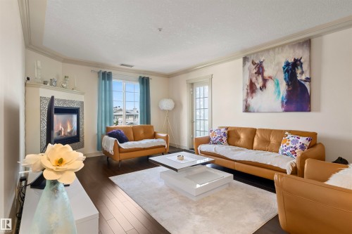 #301 16235 51 St Nw, Edmonton, AB - Indoor Photo Showing Living Room With Fireplace