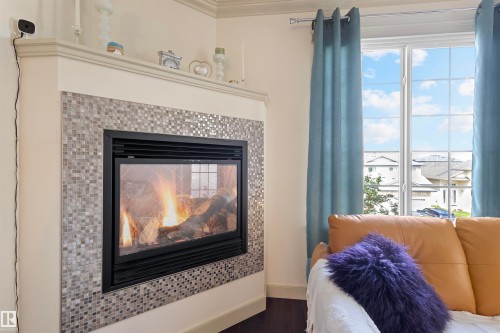 #301 16235 51 St Nw, Edmonton, AB - Indoor Photo Showing Living Room With Fireplace