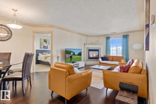 #301 16235 51 St Nw, Edmonton, AB - Indoor Photo Showing Living Room With Fireplace
