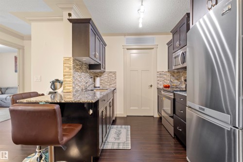 #301 16235 51 St Nw, Edmonton, AB - Indoor Photo Showing Kitchen With Stainless Steel Kitchen With Upgraded Kitchen