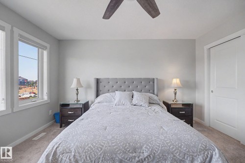Bedroom featuring light gray walls, carpet flooring, and white trim - 2314 Wonnacott Crescent Sw, Edmonton, AB - Indoor Photo Showing Bedroom