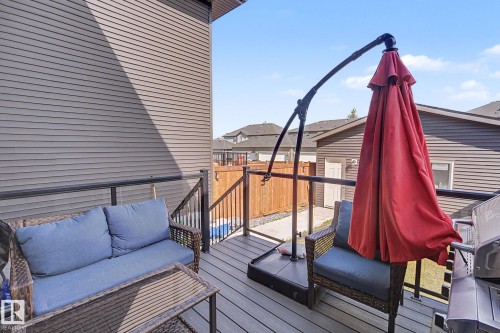 Upper-level deck featuring composite decking and black metal railings - 2314 Wonnacott Crescent Sw, Edmonton, AB - Outdoor With Deck Patio Veranda With Exterior