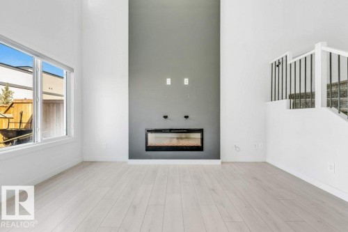 5140 23 Avenue Sw, Edmonton, AB - Indoor Photo Showing Living Room With Fireplace