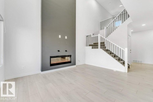 5140 23 Avenue Sw, Edmonton, AB - Indoor With Fireplace