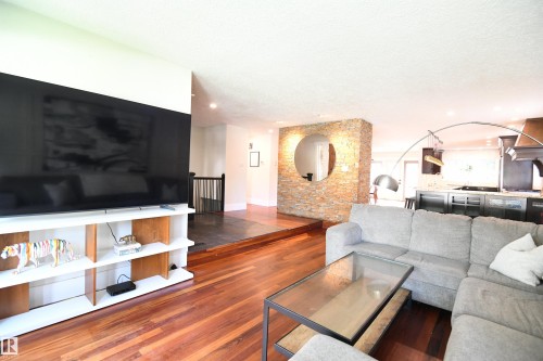 The large windows in the sunken living room are a nice touch, and the same large window format was used in the bedrooms, and even in the attached double garage - 572 Lessard Drive Nw, Edmonton, AB - Indoor Photo Showing Living Room