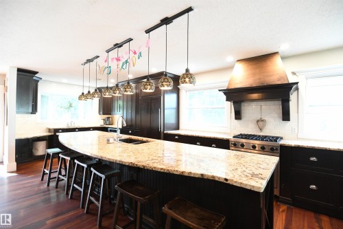 Honestly, it is tough not to stare at this island, and it is sure to be one of the largest that you will experience.  Stunning - 572 Lessard Drive Nw, Edmonton, AB - Indoor Photo Showing Kitchen With Upgraded Kitchen