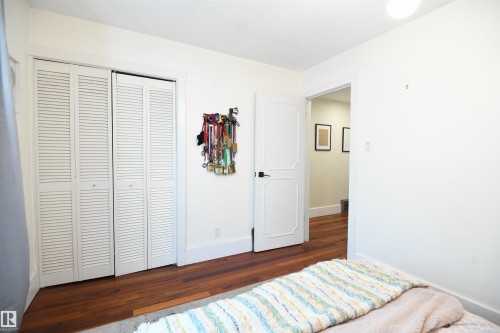 The second and third bedrooms on the main floor are both generously sized, have large closets, and wide, tall windows.  This is a great layout - 572 Lessard Drive Nw, Edmonton, AB - Indoor Photo Showing Bedroom