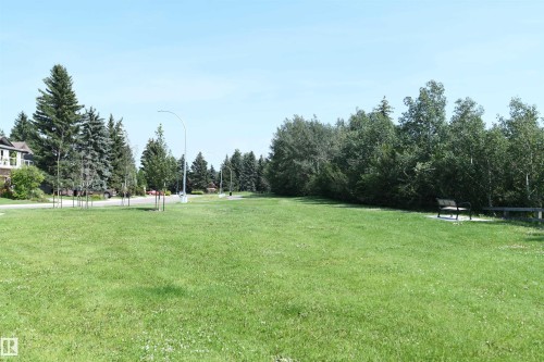 The home is located less than a block from the river valley, park, and trails.  It is also only a few short steps away from the Lessard Community League playground, on a quiet street, with easy access to amenities - 572 Lessard Drive Nw, Edmonton, AB - Outdoor