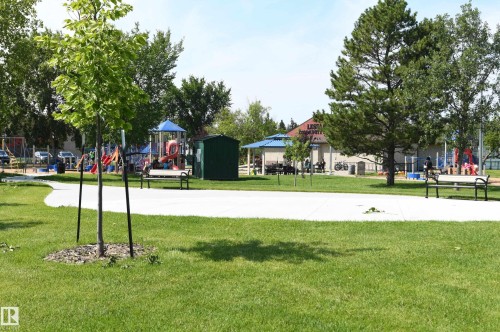The home is located less than a block from the river valley, park, and trails.  It is also only a few short steps away from the Lessard Community League playground, on a quiet street, with easy access to amenities - 572 Lessard Drive Nw, Edmonton, AB - Outdoor