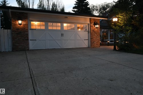 The large windows have been upgraded with vinyl units, and provide great natural light.  Upgrades to furnace water tank, and shingles have also been completed - 572 Lessard Drive Nw, Edmonton, AB - Outdoor