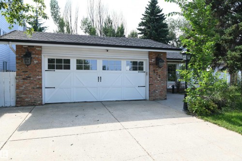 The large windows have been upgraded with vinyl units, and provide great natural light.  Upgrades to furnace water tank, and shingles have also been completed - 572 Lessard Drive Nw, Edmonton, AB - Outdoor