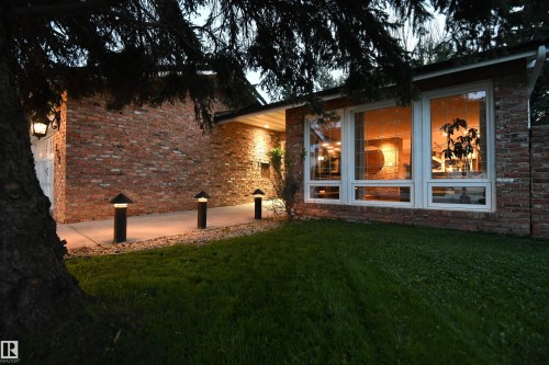 A covered grand front entrance with a double doorway welcomes you and your guests.  This is a great family home, and thanks to the open layout, and stunning kitchen, is a dream setup for entertaining - 572 Lessard Drive Nw, Edmonton, AB - Outdoor