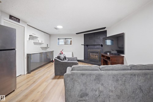2107 40 Street Nw, Edmonton, AB - Indoor Photo Showing Living Room With Fireplace