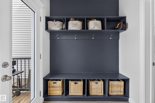 Built-in hall tree featuring multiple storage cubbies, integrated seating, and coat hooks - 6 Daniel Street, Fort Saskatchewan, AB - Indoor Photo Showing Other Room