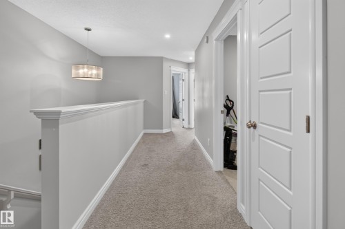 Upper-level hallway featuring neutral carpeting and light gray wall paint - 6 Daniel Street, Fort Saskatchewan, AB - Indoor Photo Showing Other Room