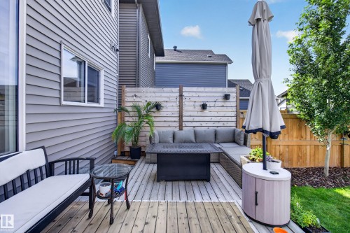Rear deck featuring wood planks and a privacy screen - 6 Daniel Street, Fort Saskatchewan, AB - Outdoor With Deck Patio Veranda With Exterior