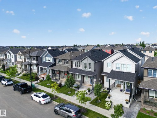 Established suburban neighborhood showcasing a row of contemporary two-story homes with varied exterior finishes including siding and brick - 6 Daniel Street, Fort Saskatchewan, AB - Outdoor With Facade
