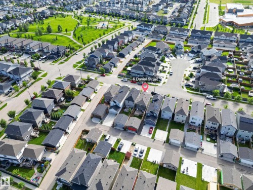 Aerial perspective showcasing a residential neighborhood with detached homes, green spaces, and paved streets - 6 Daniel Street, Fort Saskatchewan, AB -  With View