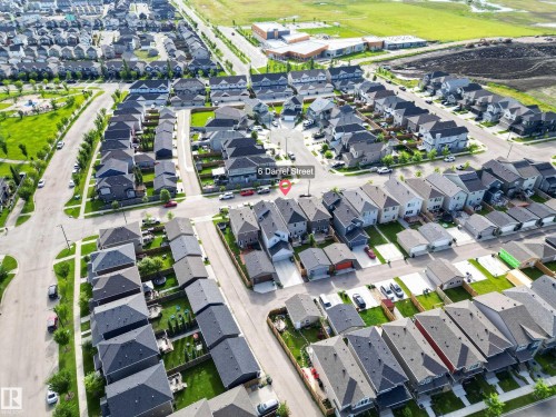 Established residential community featuring tree-lined streets, curved cul-de-sac design, and consistent architectural styling with dark-roofed homes - 6 Daniel Street, Fort Saskatchewan, AB - Outdoor With View
