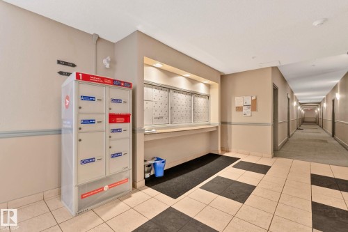 Mail and parcel delivery system with integrated mailboxes and dedicated parcel lockers - #120 8931 156 St Nw, Edmonton, AB - Indoor