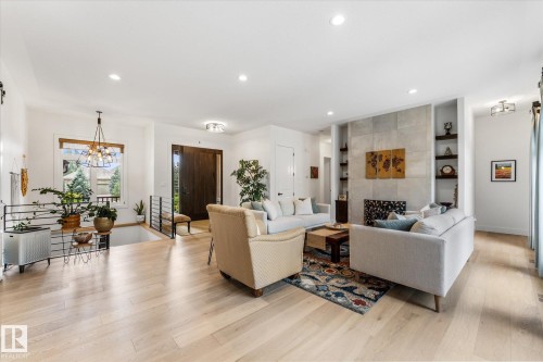 Spacious living area featuring light wood-finish flooring and recessed lighting - #52 Riverstone Close, Rural Sturgeon County, AB - Indoor Photo Showing Living Room