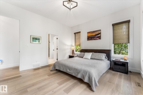 Bedroom featuring light wood-finish flooring and bright white walls - #52 Riverstone Close, Rural Sturgeon County, AB - Indoor Photo Showing Bedroom